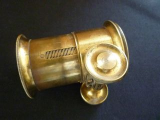 Antique Brass Lens - Marked 20 photo