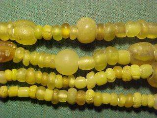 String Of Roman Yellow Coloured Glass Beads Circa 100 - 400 Ad photo