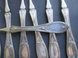 Eight Silverplate Picks In The Olive Pattern photo