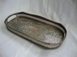 A Vintage Silver Plated On Copper Serving Tray With Raised Gallery Four Bun Feet photo
