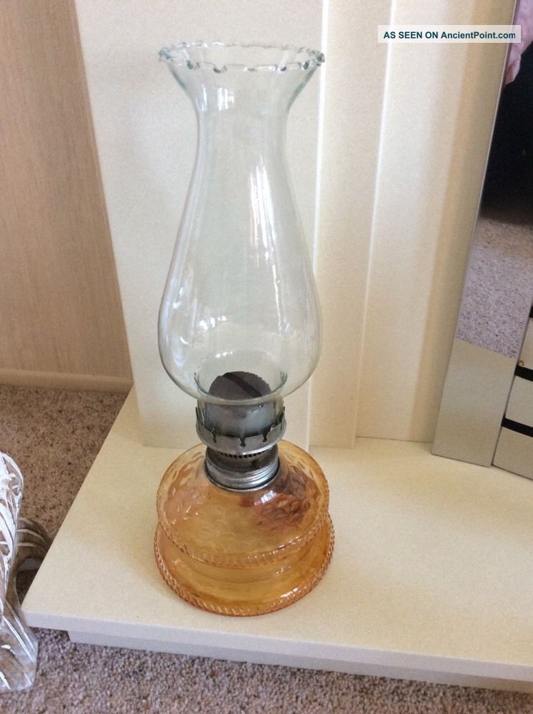 Vintage Glass Oil Lamp With Clear Glass Chimney And Amber Glass Base 20th Century photo