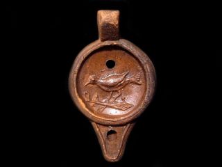 Magnificent Terracotta Roman Style Wick Oil Lamp With Bird Image photo