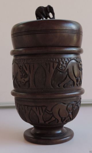 Magnificent African Wood Urn With Cover Decorated. photo