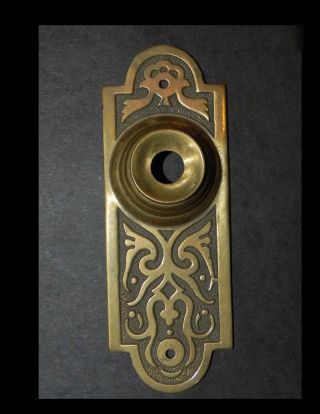 Antique Door Bell Cover In Brass photo