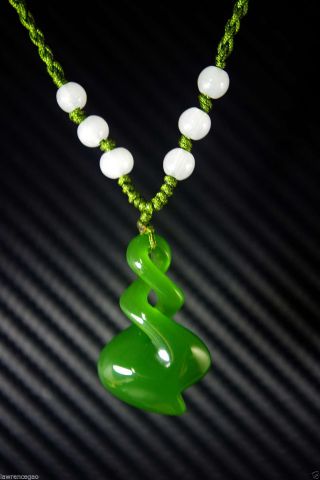 Natural Bright Green Jade Nephrite Hand - Carved Spiral Jade Pendant photo