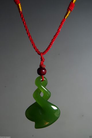 Chinese Natural Green Jade Nephrite Jade Hand Carved Spiral Jade Pendant 扭转乾坤 photo