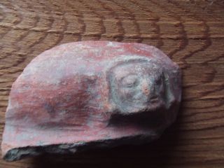 South American.  Pre Columbian.  Terracotta Section With A Moulded Face. photo