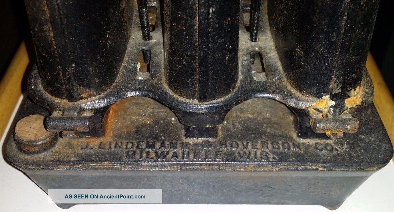 A.  J Lindemann & Hoverson Co.  Sad Iron Heater,  Three Wicks Stoves photo