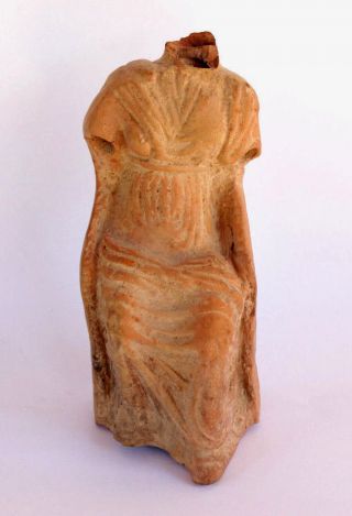 Ancient Terra Cotta Statuette Of A Dressed Nobele Women Sitting On Royal Chair photo