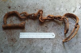 Very Rare Old Ancient Forged Viking Shackles On A Foot. photo