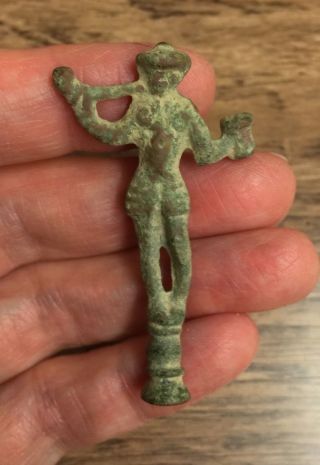 17th Century.  Brass Pipe Tamper.  Design Of A Man Holding Pipe And Tankard photo