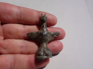 Ancient Roman Bronze Statue With Human Head And Spread Wings On Lion Paw photo