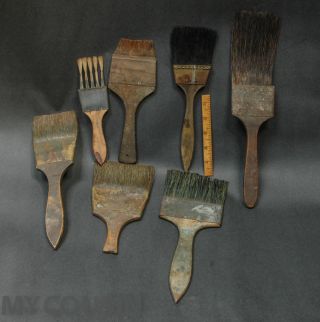 7 Antique Paint Brushes,  Wood Grainer Tools,  Primitive Folk Art Wall Hangers photo