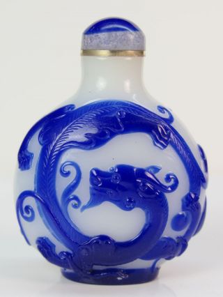 Eximious Chinese Two Dragon Carved Peking Overlay Glass Snuff Bottle photo