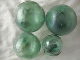 4 Authentic Different Size Japanese Glass Fishing Floats,  All Marked photo
