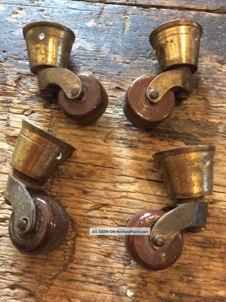 Four Antique Brass And Porcelain Frniture Casters Other Antique Hardware photo