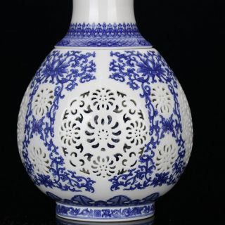 Chinese White & Blue Porcelain Hand Painted & Hollow Carved Vase W Qianlong Mark photo