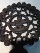 Antique Cast Iron Footed Round Trivet With Hearts And Child Design Trivets photo 1