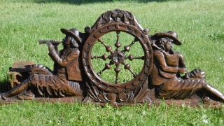 19thc Black Forest Oak Carved Pediment With Male Pipers & Wheel photo
