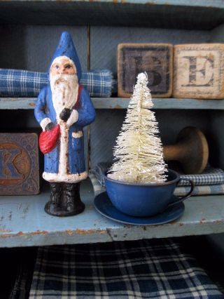 Bottle Brush Christmas Tree In A Tiny Antique Blue Tin Toy Cup And Saucer photo