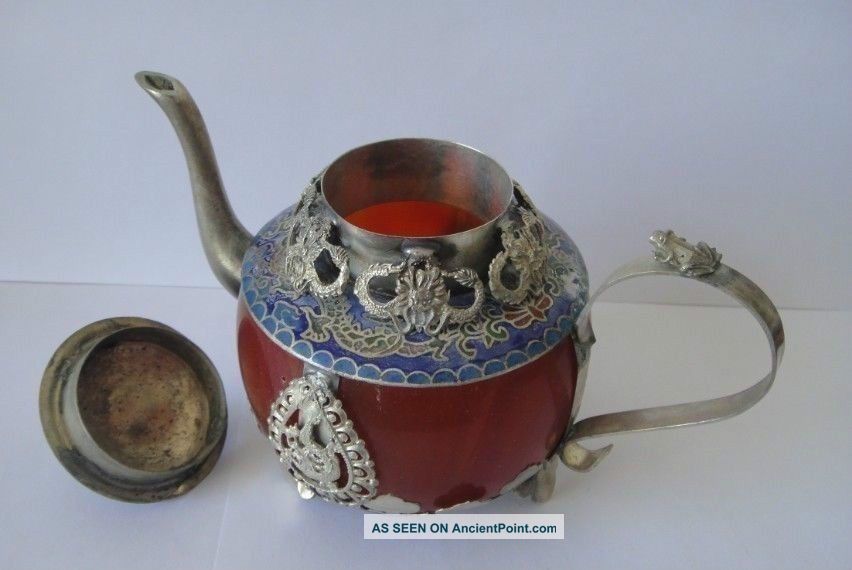 Collectible Decorated Old Handwork Jade Tibet Silver Dragon Tea Pot Monkey Lid See more Collectible Decorated Old Handwork Jade Tibet ... photo