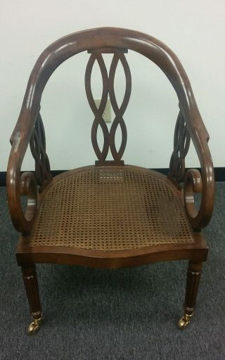 Antique Vintage Reddish Brown Wood Caster Chair W/ Cane Seat photo