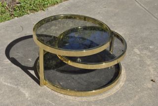 Mid Century Milo Baughman Style Brass Plated Tiered Swivel Glass Coffee Table photo
