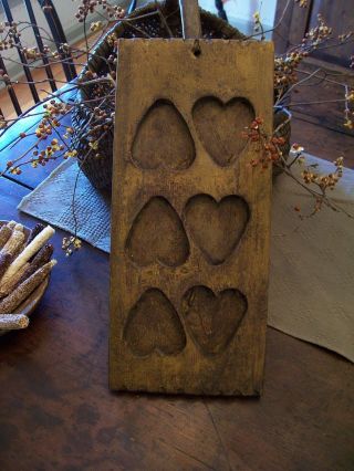 Primitive Styled Wooden Wood Heart Mold - Mustard Paint photo