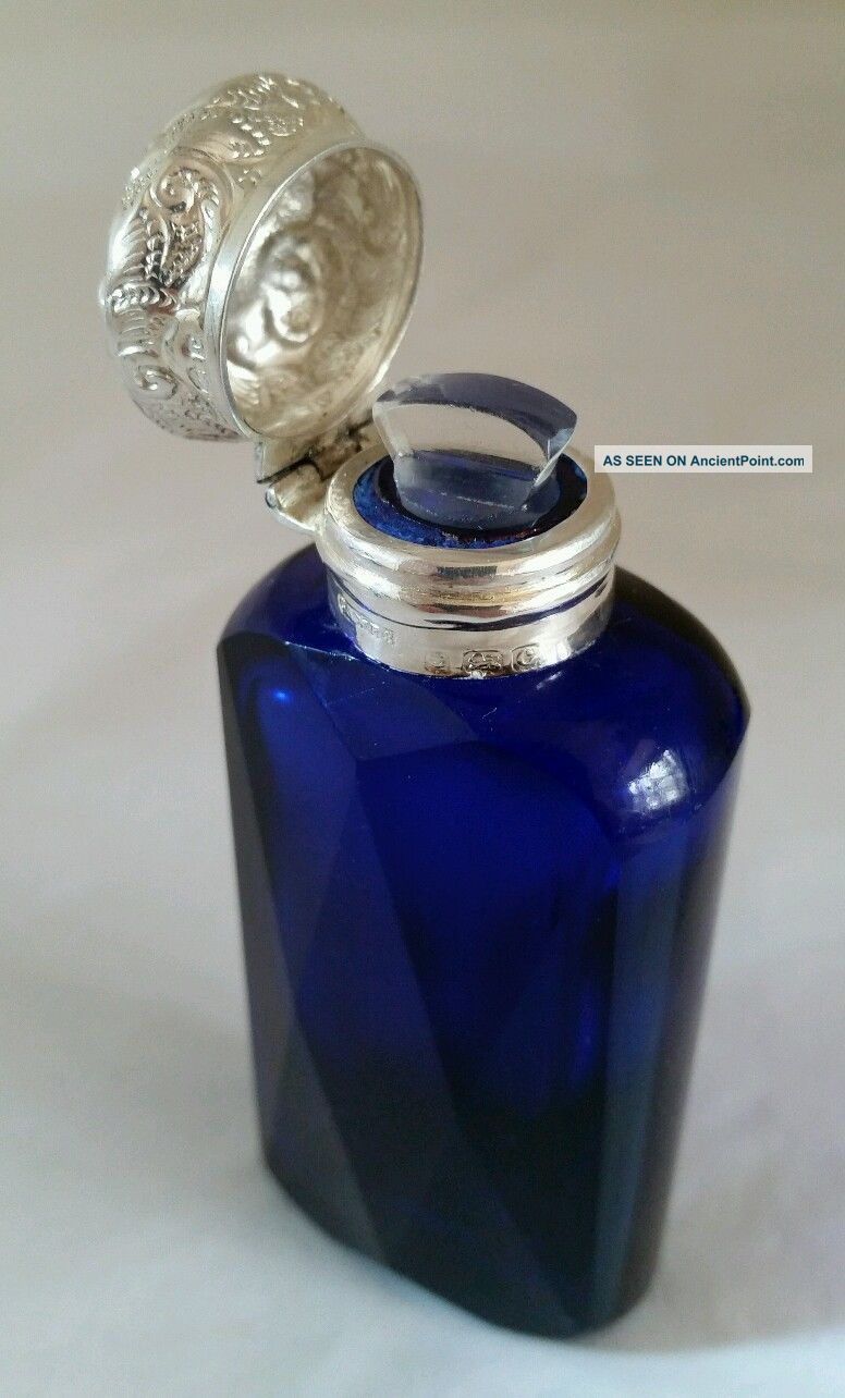 A Cut Glass Bristol Blue Scent Bottle.  Sterling Silver Mount.  Birmingham 1902 Bottles photo