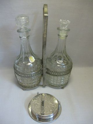 Vintage 2 Decanters Silver Tone Carrier Stand Silver Plate Tone Coasters Stand photo