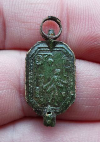 A Brass Watch Key With A Man With A Lantarn From The 18th.  Century. photo