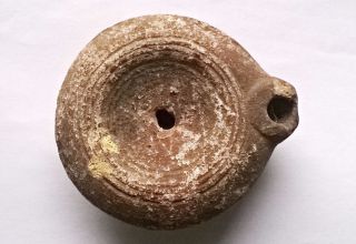 Ancient Roman Terracotta Pottery Oil Lamp With Concentric Circle Pattern photo
