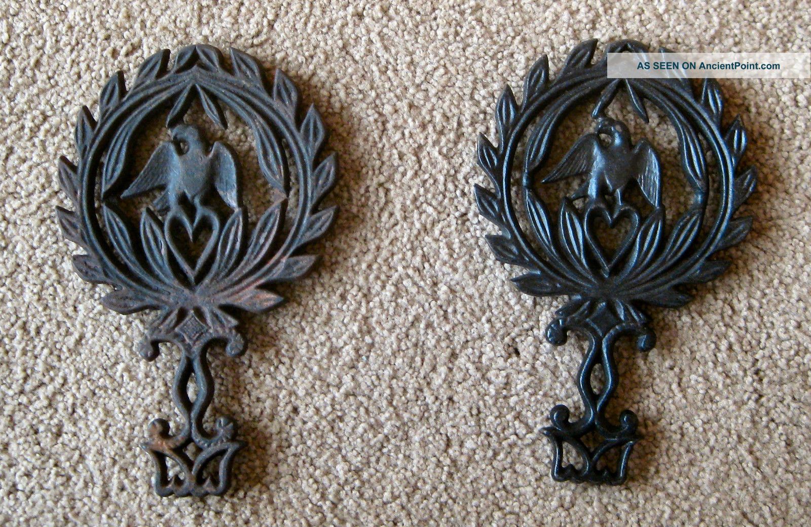 Two Vintage Cast Iron Eagle/heart Trivets Wall Hanging (one Labeled 1949 4) Trivets photo