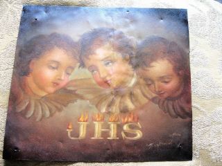 Vintage Retablo On Tin With Three Angel Faces With Wings photo