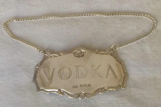 A Vintage Solid Sterling Silver Vodka Decanter Label By Birmingham 1986.  A photo