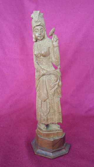 An Asia Wood Carved Statue photo