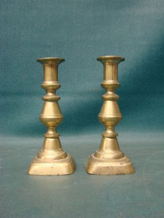 Antique Brass Push - Up Candlestick Holders photo