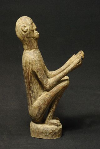 Expressive Figure Of Ancestor With Outstreched Hands - Timor - Indonesia photo