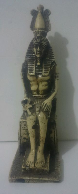 Ancient Egyptian Statue Of King Ramses Ii Sitting Holding Ankh photo