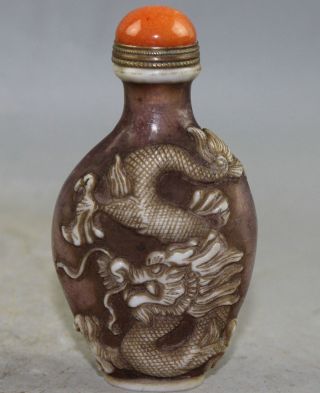 Chinese Coloured Glaze Carving Dragon And Phoenix Snuff Bottles photo