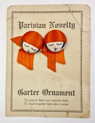 Lovely Garter Buttons With Deep Orange Hat And Ribbon On Card photo
